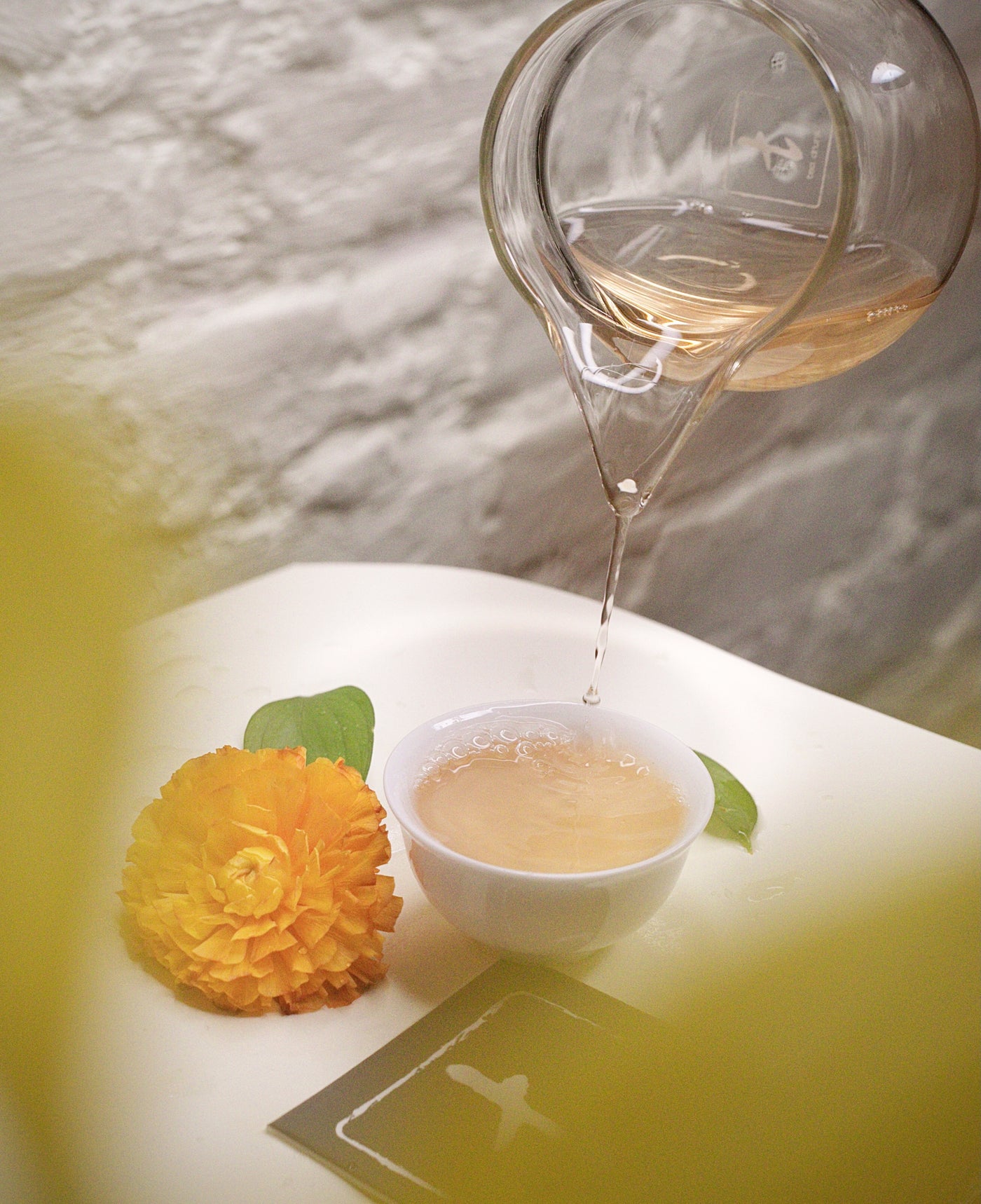 Tea being poured during a comparative tasting.