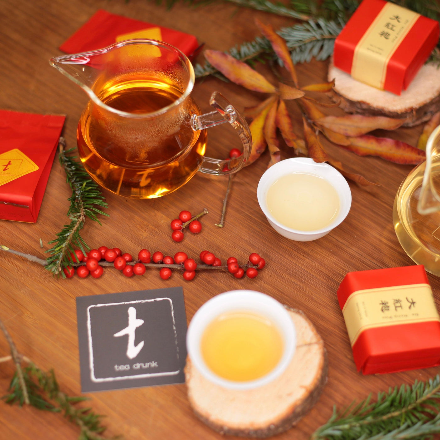 Tea packets, teaware, and brewed tea arranged for the Classic Tea Sampler.